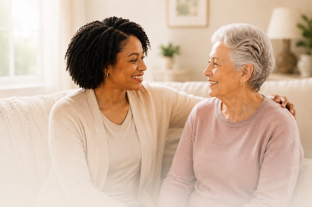 Two women sharing a warm moment together on a sofa